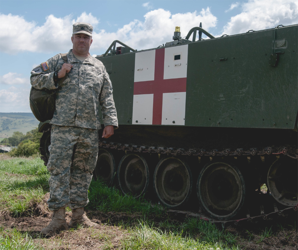 Soldier standing in front of a military medical vehicle. Click to be taken to special circumstances TDY. Soldier standing in front of a military medical vehicle. Click to be taken to special circumstances TDY.